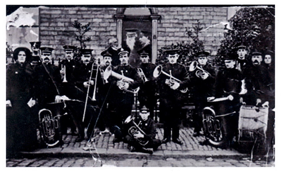 General Booth (in doorway)and the New Mills Salvation Army Band at a house on High Street, opposite the Masons Arms!