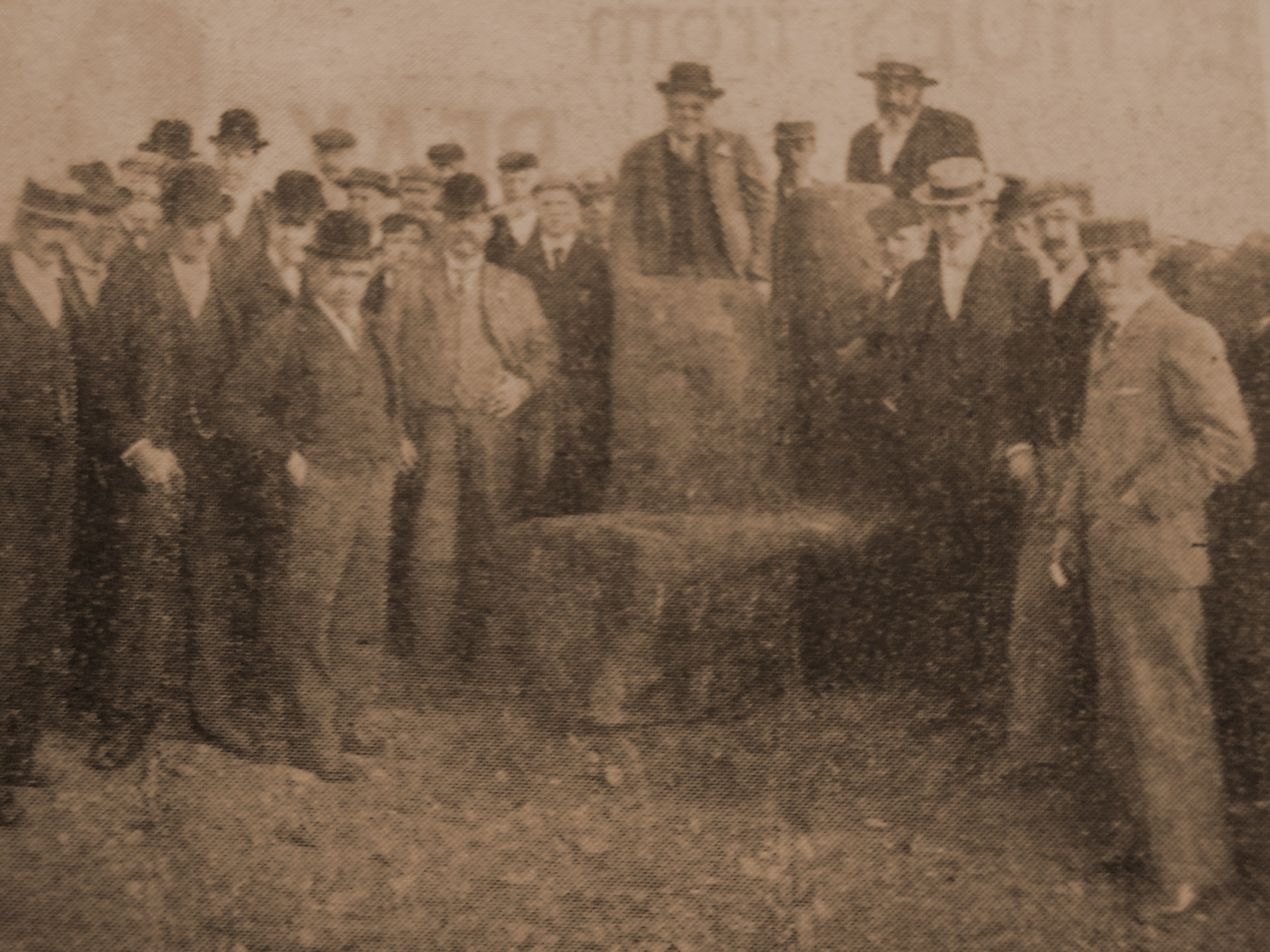 The group pose for a photograph before restoring the stones