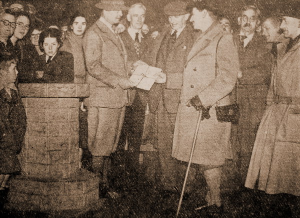 Mr Molson hands the deeds to to Major G.G. Havthornthwaite